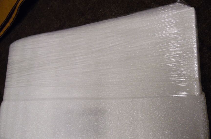 The inner soft foam wrap touching the<br />door is held on with shrink wrap.<br />No staples, no tape, just shrink wrap.