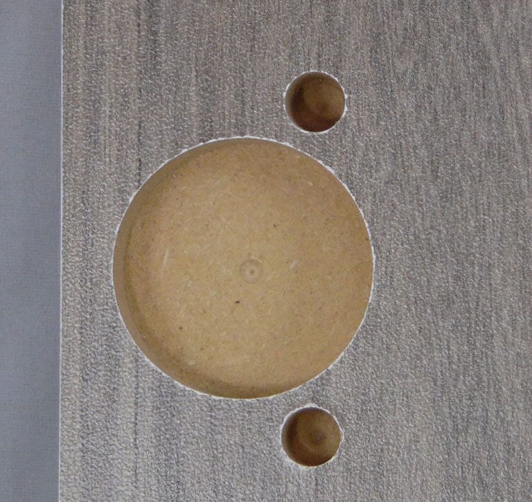 Hinge boring on door with matching laminte<br />back. Doors can have white, black, or matching<br />color backs for many 3D laminte colors.