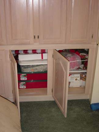 This customer really increased his storage space,<br />and this is not a kitchen. It seems to be a bedroom<br />converted into a sitting area or den.