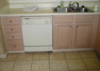 A drawer bank and base cabinets.<br />Mixing raised panel doors with slab<br />drawer fronts. Two below sink are<br />false fronts. They are fixed.