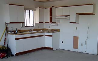 This melamine style with wood pulls top<br />and bottom was quite popular at one time.