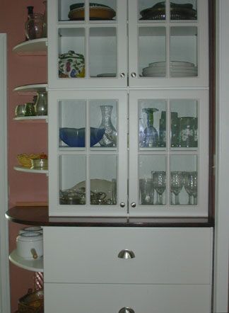 Thermal foil 4-Lite mullion doors in a stack.<br />Using 4 doors instead of 2 really tall doors.<br />Big slab drawer fronts below.