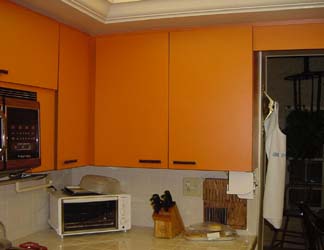 Other side of Mrs. Cunningham\'s kitchen.<br />An old melamine cabinet look.