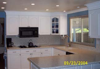 Other side of that same kitchen. Notice the<br />6-lite cathedral arch top corner cabinet door.<br />Setting a focal point in the kitchen.