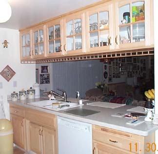 Lighter and brighter mullion door cabinets after.<br />Base cabinets changed too.