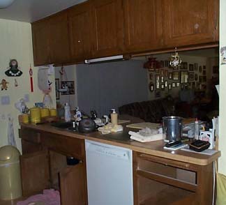 Dark upper wood cabinets before.