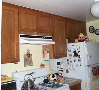 Dark upper cabinets before.