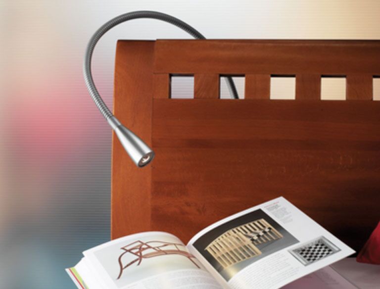 Close up view of the flexible Hera Edenroc reading light. The on/off switch is positioned in the base of the light. This one is shown with t