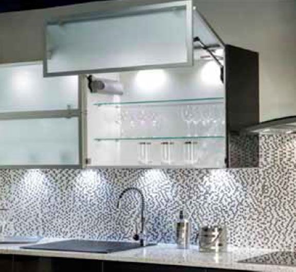 That same kitchen with the vertical lifting diffused glass door shown open. Looks like they have two spotlights inside the cabinet to light 