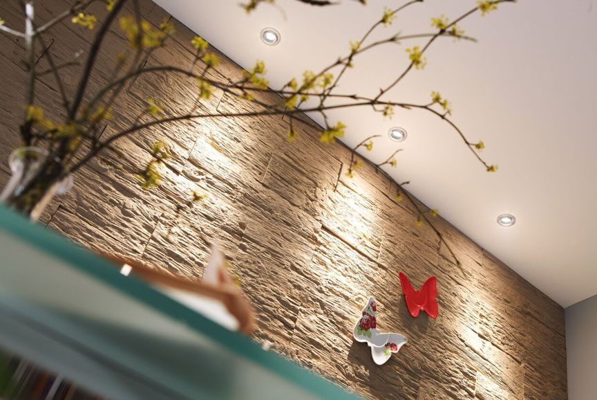 Hera SR68-LED light. A 5.3 watt LED with swivel capability. Thus something much brighter and something you can focus on display objects. The